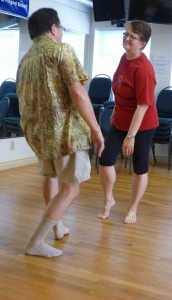Photo: two adults dancing facing each other smiling